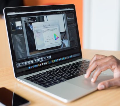 A user scrolling a laptop